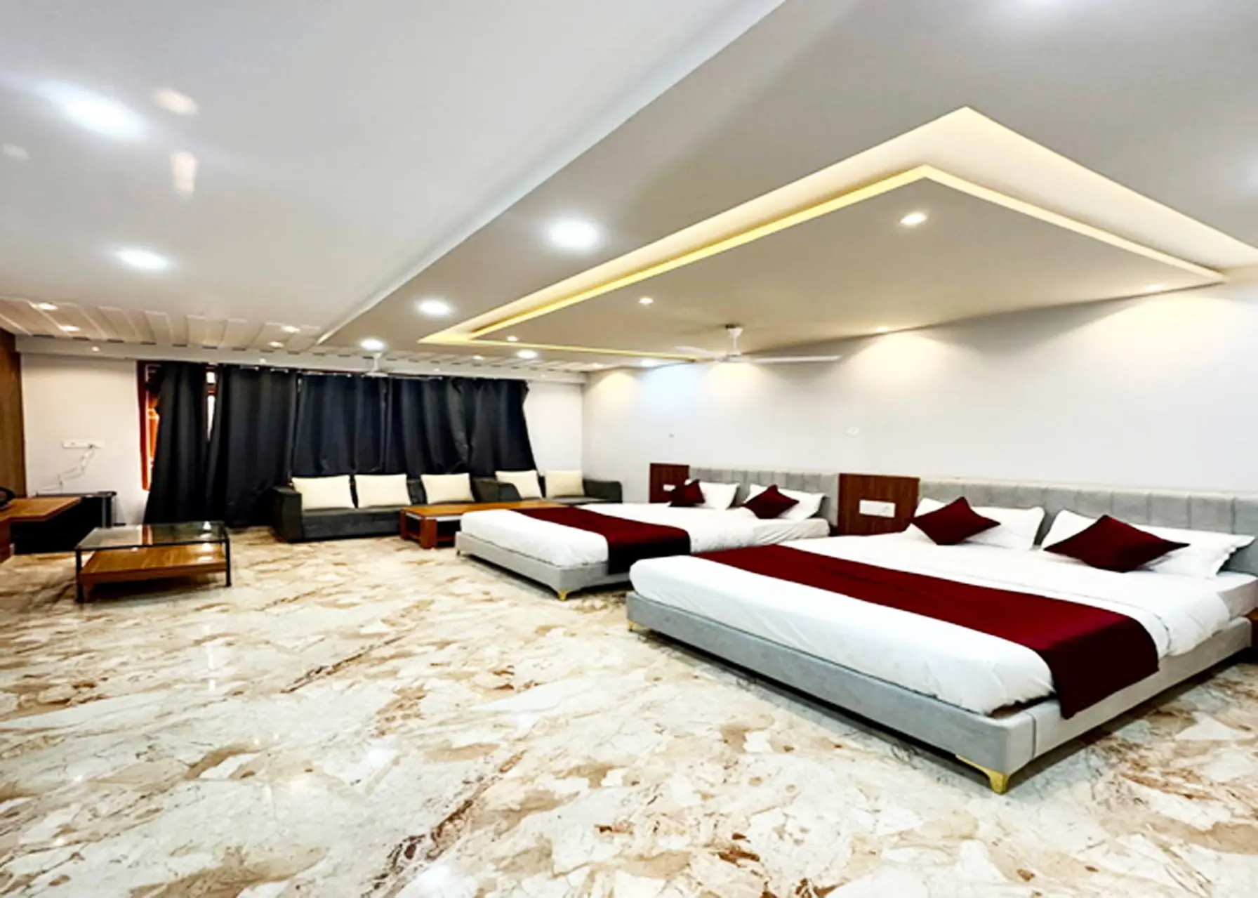 Family suite with two double beds and sofa, perfect for groups